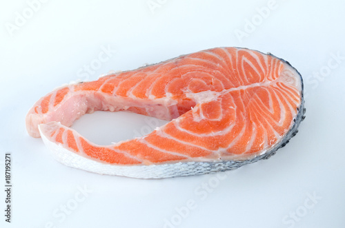Slice of salmon on white background.