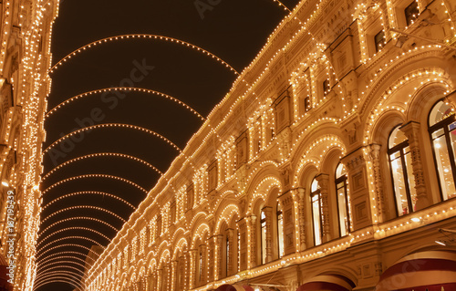 Christmas and New Year city decorations at night. Christmas lights garlands.