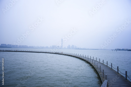 A bridge with blurred city background © ddukang