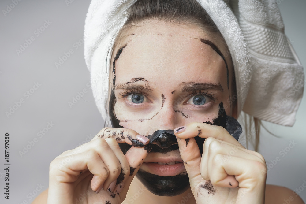 Woman remove black mask,good results. Face scrub ,exfoliation pores, clean  skin Stock Photo | Adobe Stock