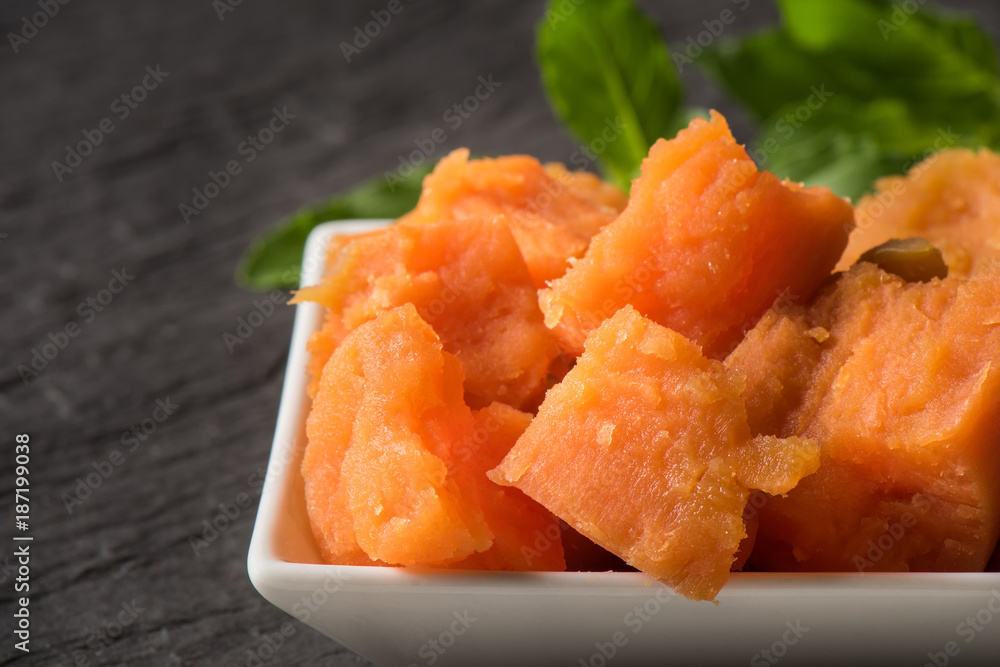 Close-up sweet potatoes in container for serve, Anthocyanin food for healthy eating and healthy lifestyle, Nutrient potatoes food and high antioxidant Close-up sweet potatoes in container for serve, Anthocyanin food for healthy eating and healthy lifestyle, Nutrient potatoes food and high antioxidant