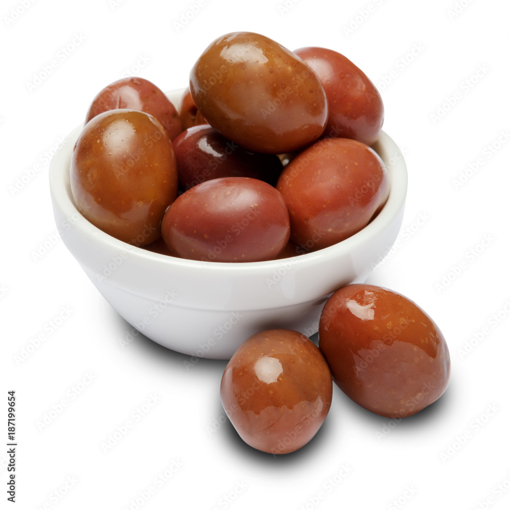 olives in white bowl on white background olives in white bowl on white background