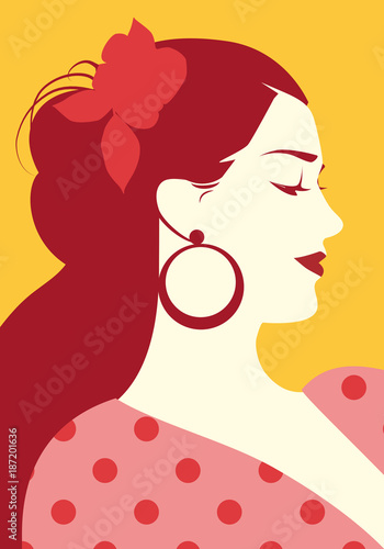 Beautiful spanish woman with flower in her hair and polka dot dress wearing big circular earrings