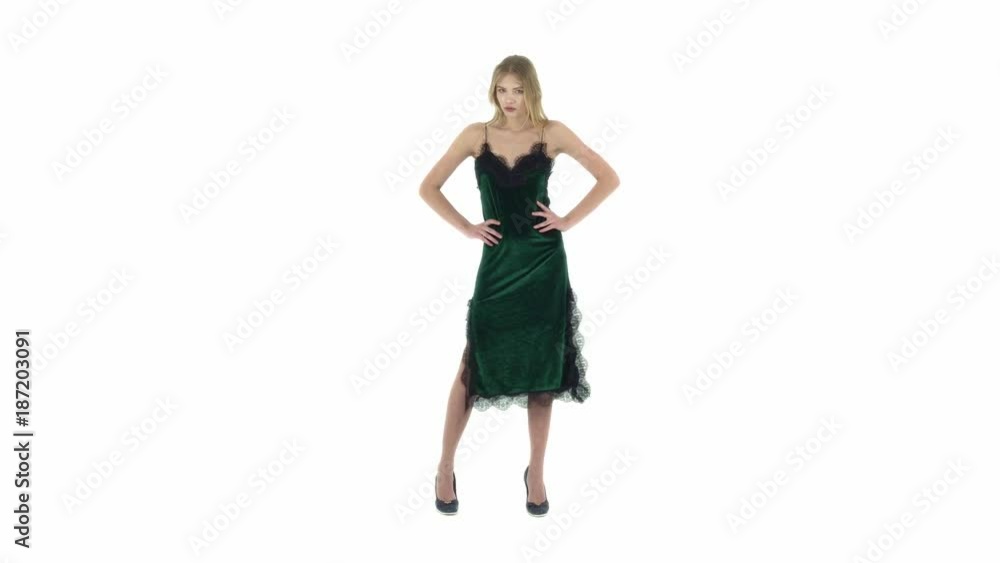 fashion model in green dress on a white background fashion model in green dress on a white background