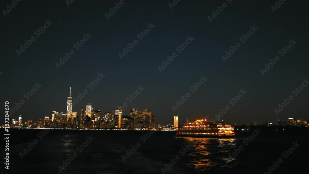 New York City Manhattan Skyline at night from Staten island ferry New York City Manhattan Skyline at night from Staten island ferry