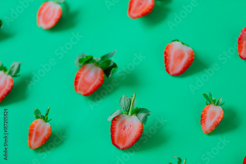 Fototapeta Naklejka Na Ścianę i Meble -  Strawberries isolated on green background.
