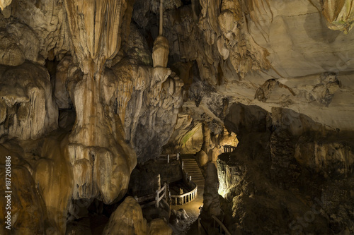 Cave with concrete foot path and light in Laos, Asia