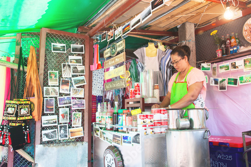 KANCHANABURI, THAILAND - JANUARY 1, 2018 : Street local cafe in Sangklaburi, many coffee shop and souvenir shop on the street to Uttama Bridge, Landmark of Sangklaburi, Kanchanaburi, Thailand photo