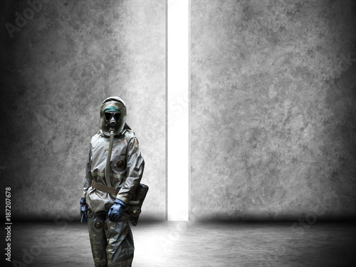 Scientist dosimetrist (radiation supervisor) in protective clothing and gas mask photo
