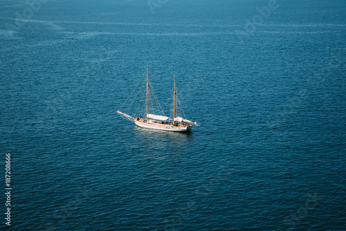 lonely boat on calm sea © alexxx068