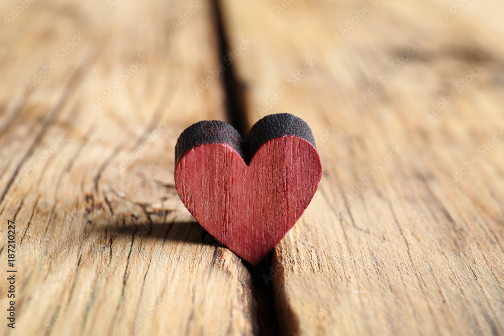 Small heart on wooden background Small heart on wooden background