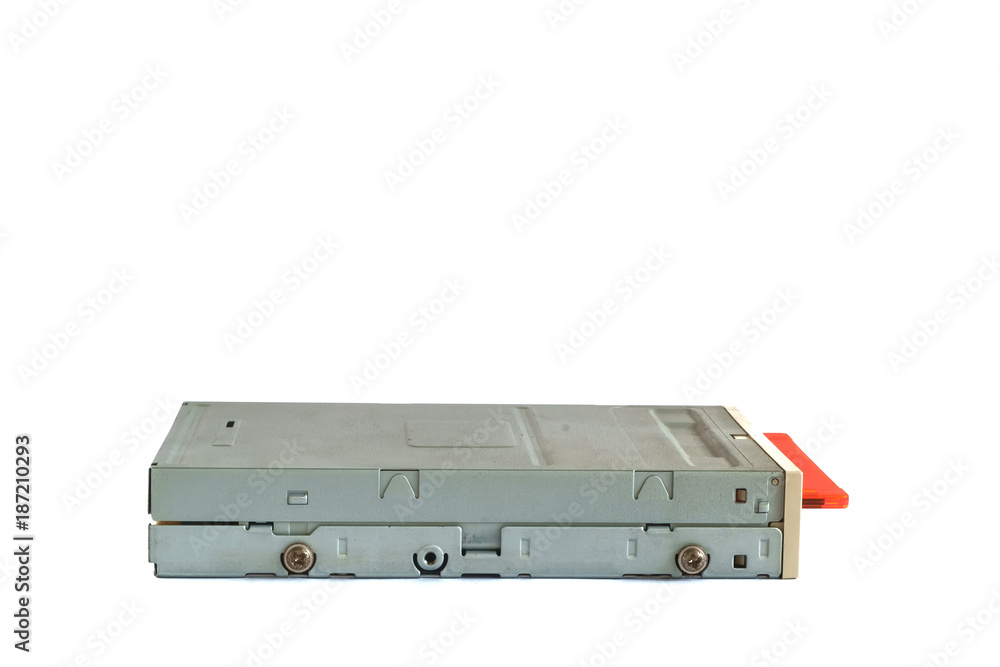 Floppy disk drive and diskettes on white background, old technology and legacy industrial computer equipment Floppy disk drive and diskettes on white background, old technology and legacy industrial computer equipment
