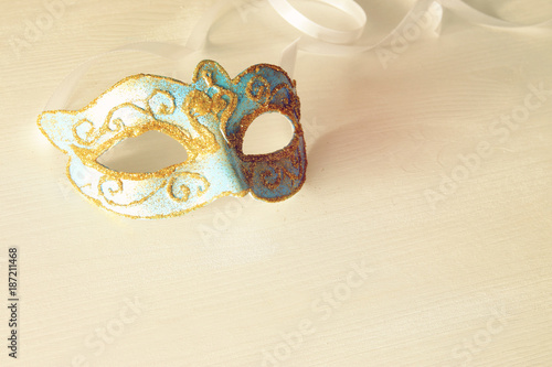 Image of delicate blue elegant venetian mask white background.