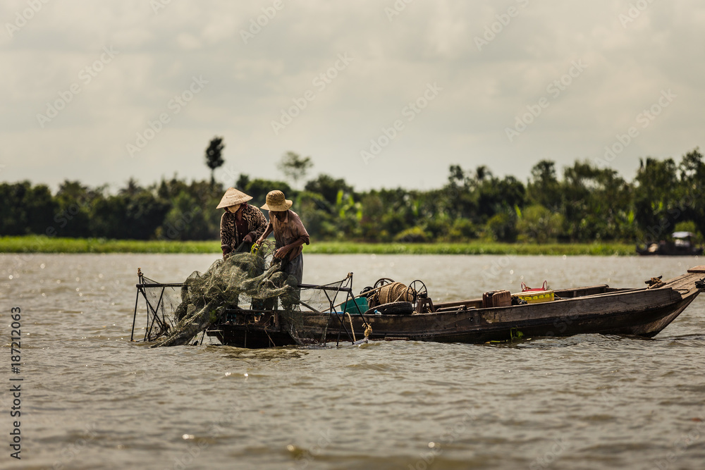 Fototapeta premium Fishermen on the Mekong river