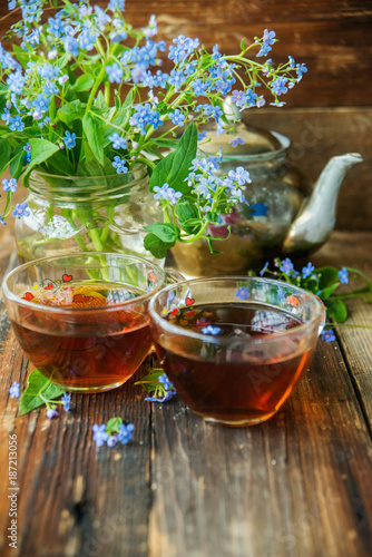 Tea and forget-me-nots photo