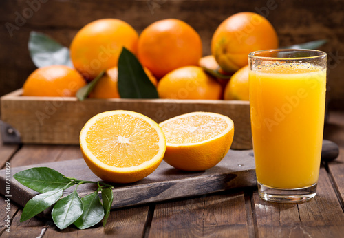 glass of fresh orange juice with fresh fruits