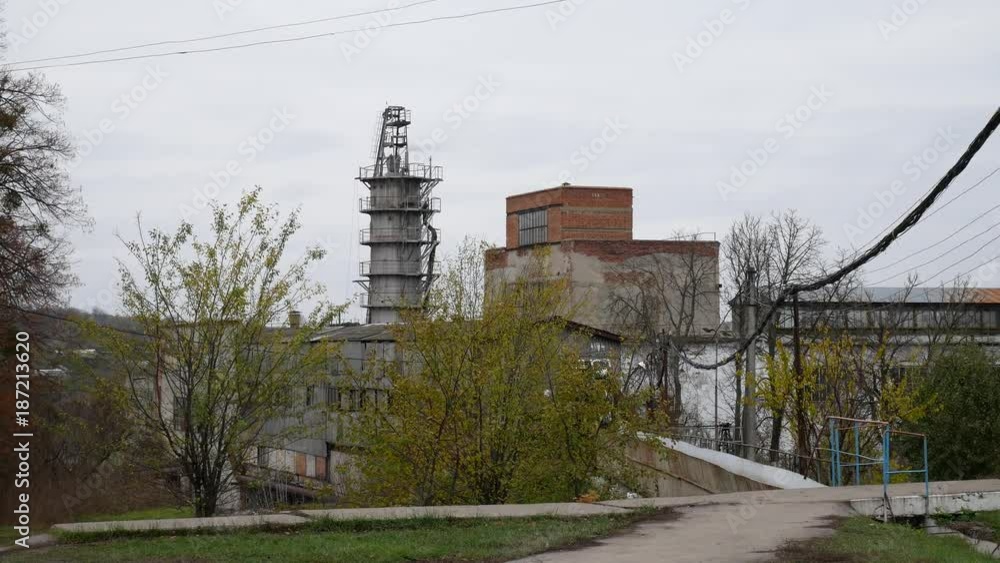 Old factory building outside. Industrial buildings exterior for production of sugar from sugar beets Old factory building outside. Industrial buildings exterior for production of sugar from sugar beets