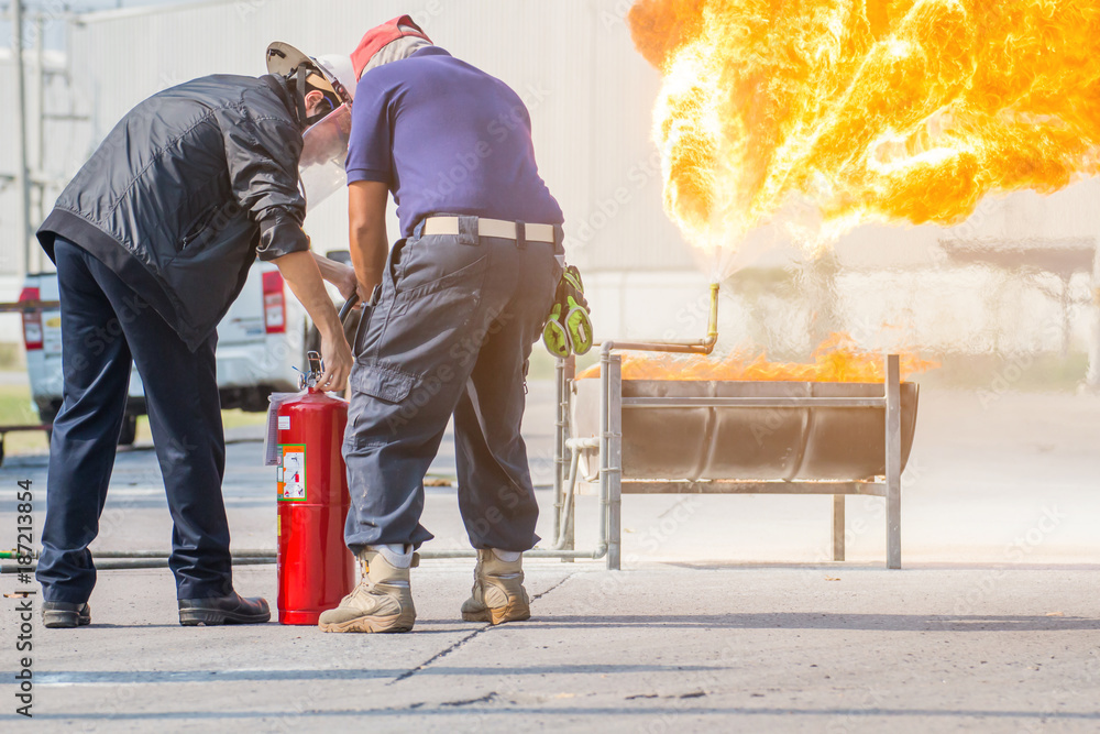 Fototapeta premium Firefighter training, The Employees Annual training Fire fighting with gas and flame