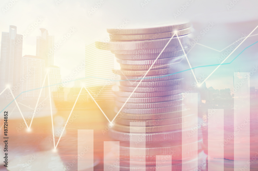 Finance, profit, capital banking and investment concept, Double exporsure stacked of coins and night city with graph. Finance, profit, capital banking and investment concept, Double exporsure stacked of coins and night city with graph.