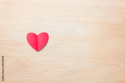 Red paper heart on wooden background, love and valentine concept