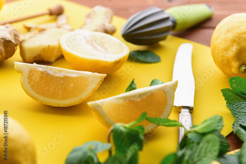 lemon and ginger with mint and honey. on a wooden background in a rustic style.