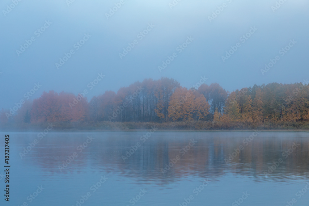Foggy Sunrise Reflection in the Tetons in Autumn Foggy Sunrise Reflection in the Tetons in Autumn