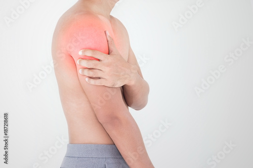 Wallpaper Mural Young man suffering from pain the shoulder, Health Care Concept. Torontodigital.ca