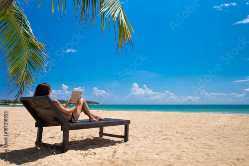 Happy woman relaxes on beach © liskam
