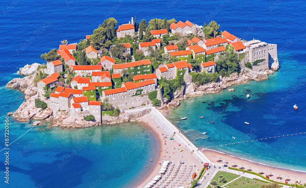 Travel and tourism: features of the Mediterranean architecture; panorama of Sveti Stefan island in a beautiful summer morning in Budva, Montenegro.