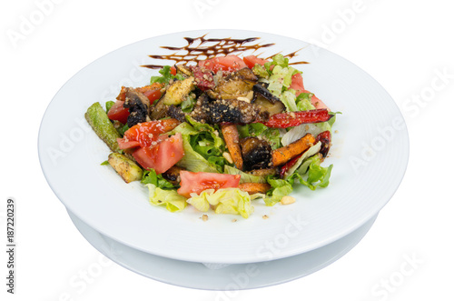 Salad. Vegetables baked on barbecue. On a white background.
