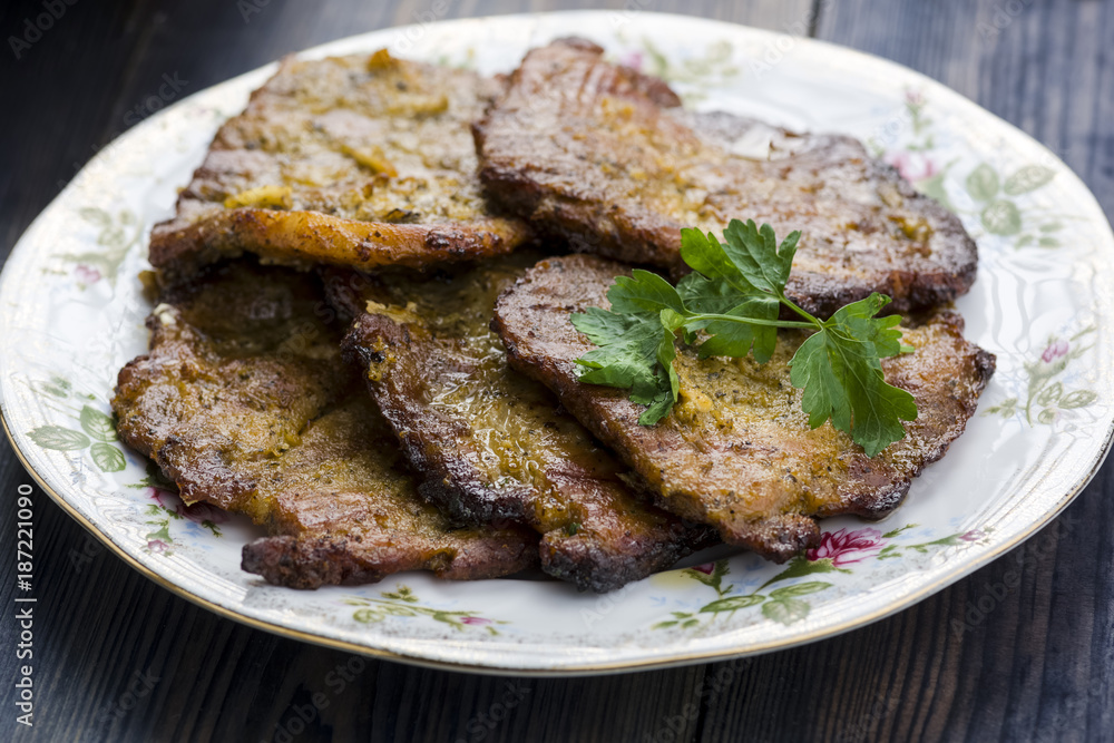 A plate of roast pork A plate of roast pork