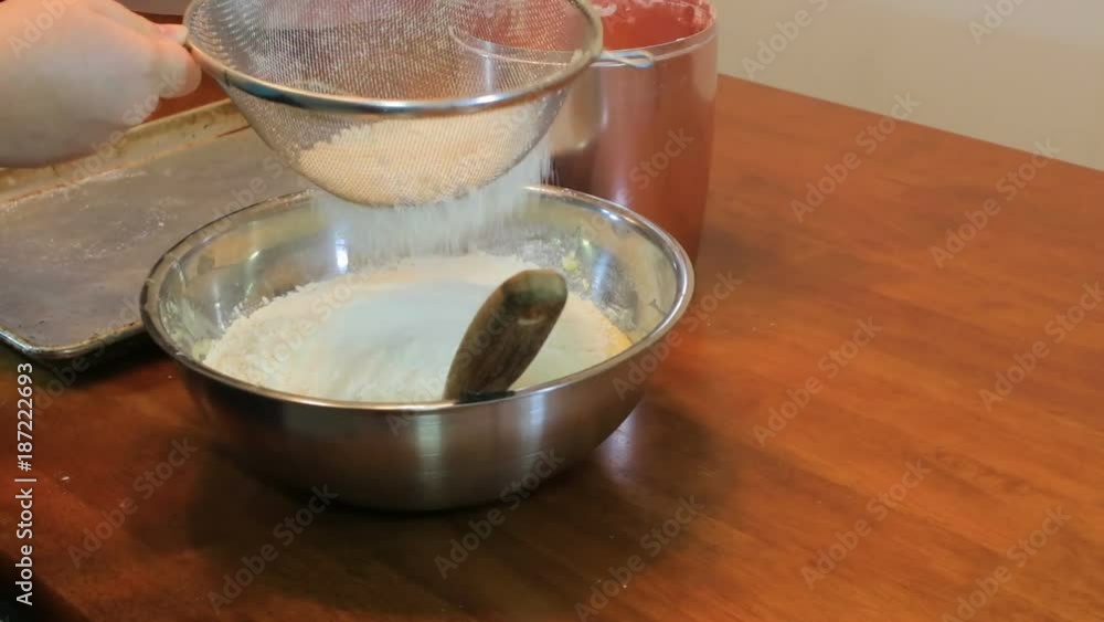 shaking flour through sieve shaking flour through sieve