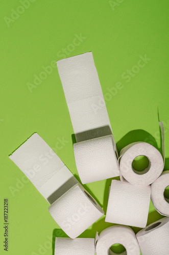 Toilet paper concept on green background. Hygiene and health. Concept photo.