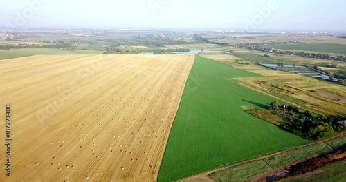 Aerial shot of fields with various types of agriculture. Farming. Aerial shot of farmland. Aerial shot of agricultural fields. View of agricultural Fields crops harvest. Rural Landscape. Counrtyside photo