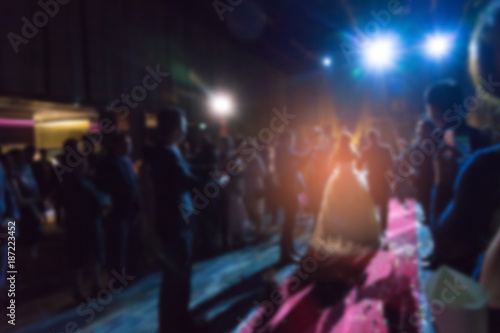 blur image of wedding party in large hall for background.A blurred wedding background © anon