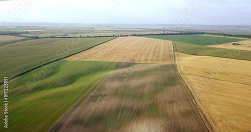 Aerial shot of fields with various types of agriculture. Farming. Aerial shot of farmland. Aerial shot of agricultural fields. View of agricultural Fields crops harvest. Rural Landscape. Counrtyside photo