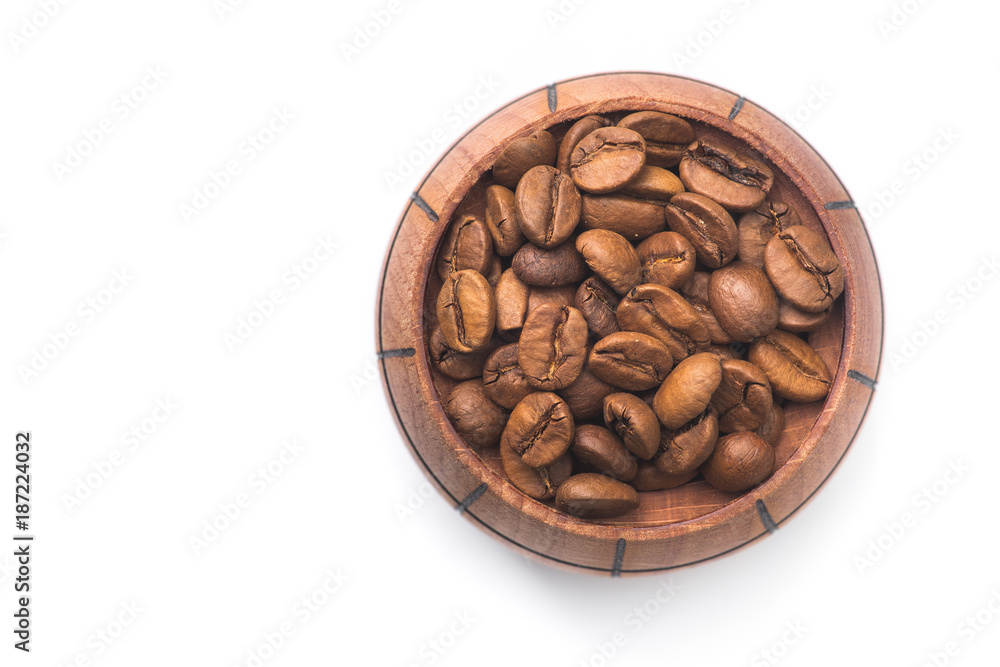 Roasted coffee beans in a wood barrel Roasted coffee beans in a wood barrel