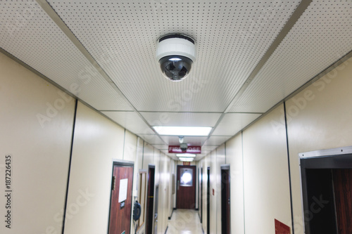 CCTV system security camera or cctv camera on ceiling in apartment room or living quarter