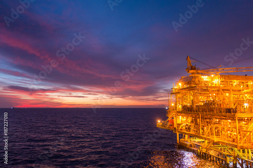 Fotografi Offshore oil and gas rig platform with beautiful sunset time or twilight time in