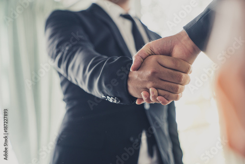 Businessman shake hands agree deal of big lot sales that finish goal of marketing plans of the company photo