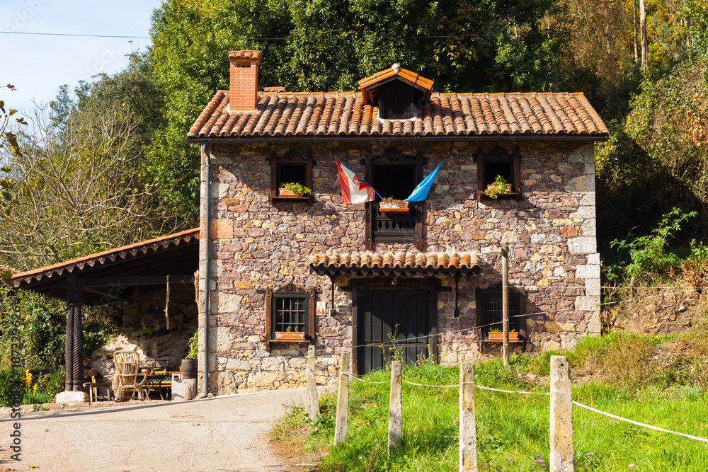 Beatiful house with flags near Paladin, Asturias, Spain Beatiful house with flags near Paladin, Asturias, Spain