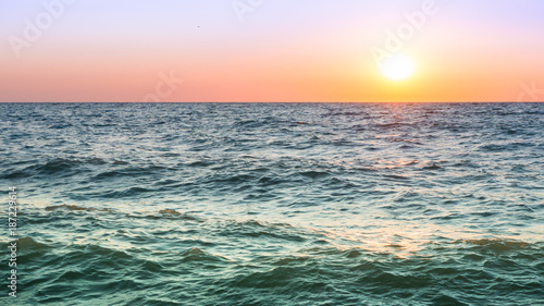 Colorful seascape. Sea waves at sunset