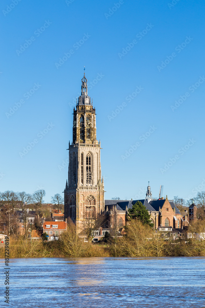 Landscape with a view on the flooded river Rhine and the small town  Rhenen in the Netherlands