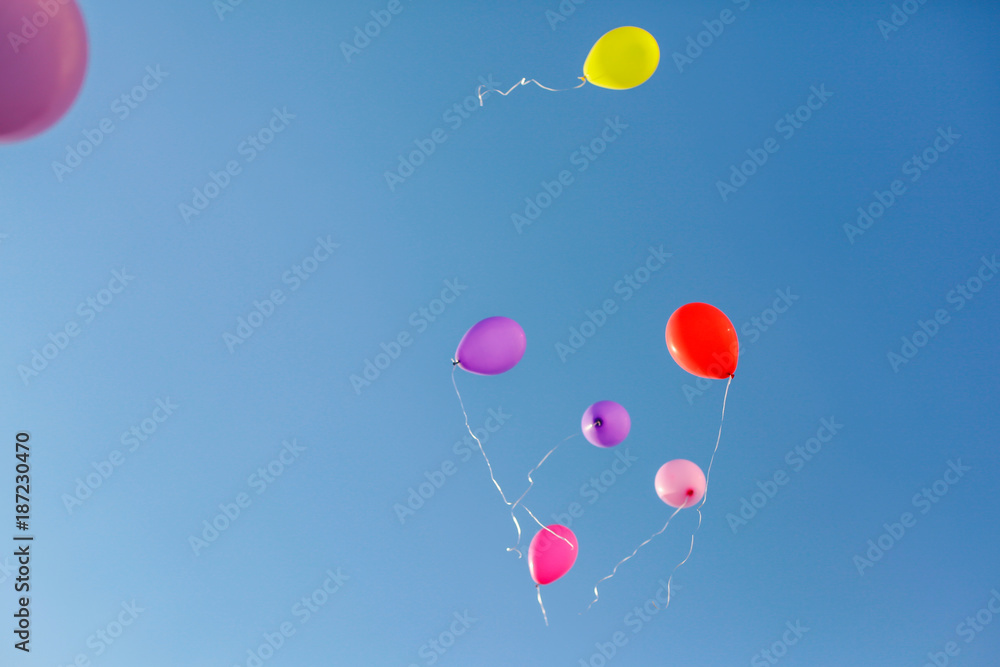 Colorful baloons raising to the sky Colorful baloons raising to the sky