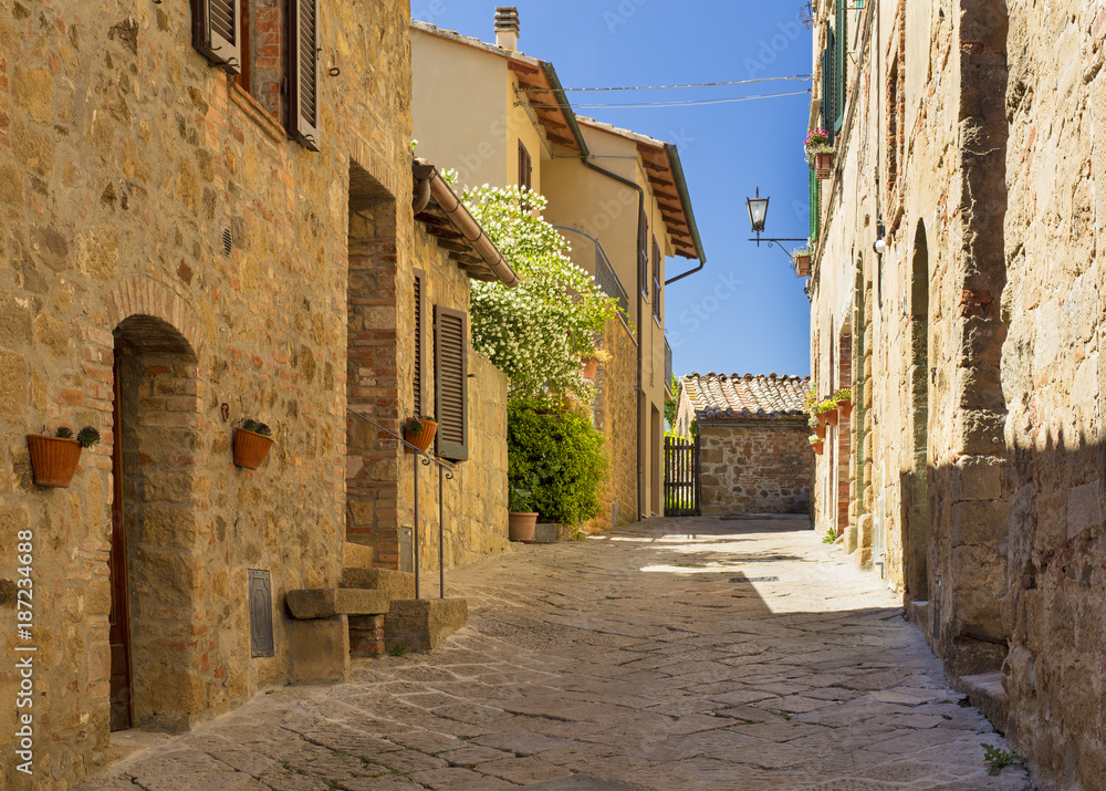 sunshining day on the street in Tuscany city