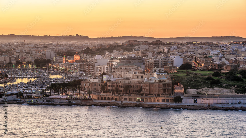 Malta: Il-Gzira and Marsans Harbour. Aerial view from city walls of Valletta at sunset