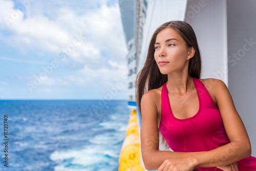 Cruise ship luxury travel Europe holiday in Mediterranean sea or European destination. Elegant chinese woman on deck portrait.