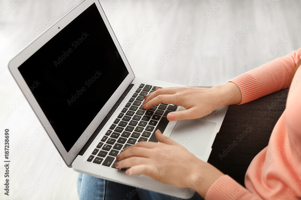Young woman working on laptop at home, closeup Young woman working on laptop at home, closeup