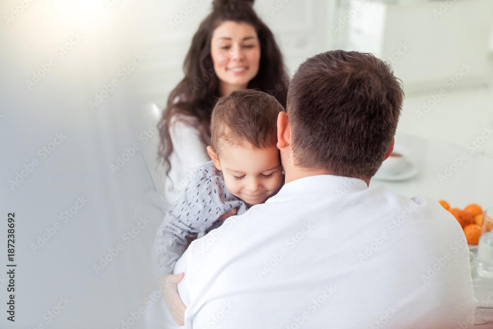Father and little child son having happy time at home in dining room Father and little child son having happy time at home in dining room