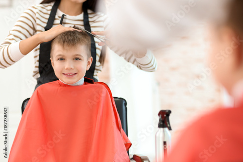 Female hairdresser working ...